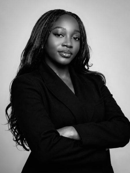 Black-and-white portrait of Dr. Phi Owusu, host of The Transformed Minds podcast